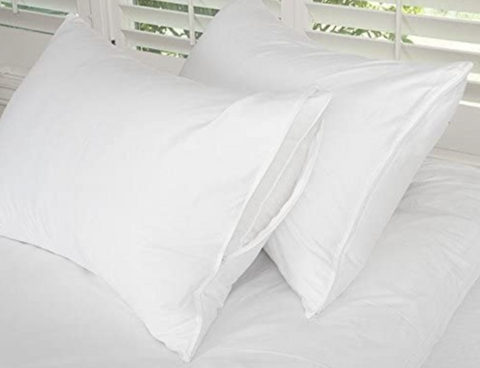 Two Down Etc. Premium Pillow Protectors with Teardrop Closure on top of a white bed.