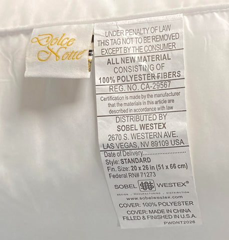 pillow featured at the red lion hotels. Standard size with the tag reading 100% polyester cover and 100% polyester fill